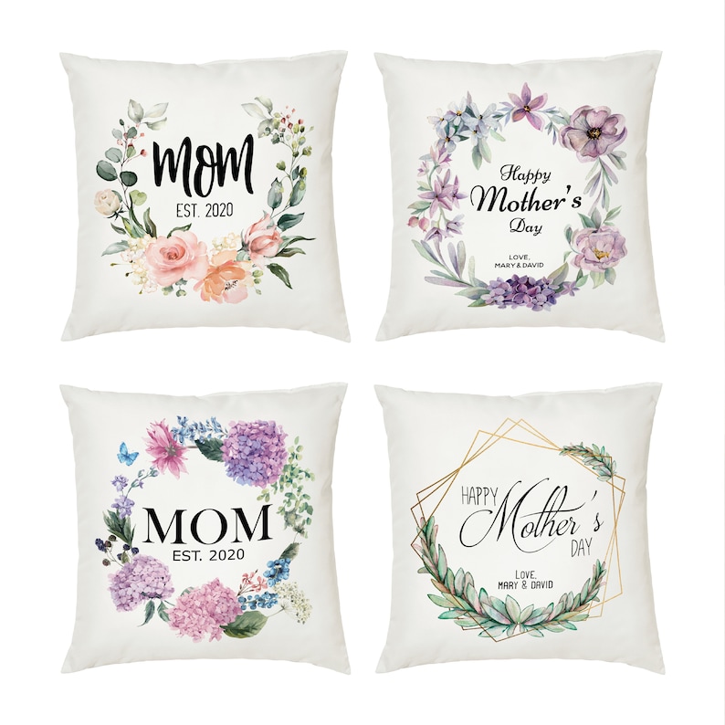May include: Four white pillowcases with floral designs and text. The pillowcases feature watercolor floral wreaths with the text "Mom" and "Happy Mother's Day".