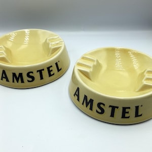 Set of two AMSTEL porcelain ashtrays, Advertising ashtrays