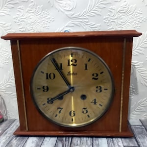 Vintage  wall clock Stone wooden mechanical  with its key from West  Germany