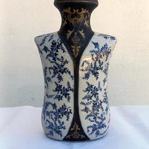 Vase for flowers into the shape of a body, Pottery blue vase