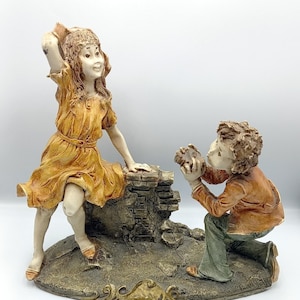 Vintage figurine girl and a boy taking photos, Vintage table figurine statues
