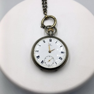 Antique Omega pocket watch with its chain