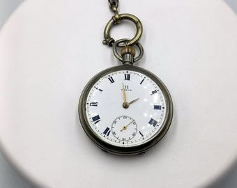 Antique Omega pocket watch with its chain