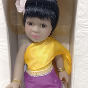 Porcelain doll wearing a costume of India