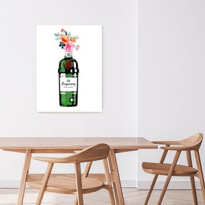 May include: A watercolour painting of a green bottle of Tanqueray gin with a bouquet of pink and orange flowers in the top of the bottle. The bottle is on a white background.