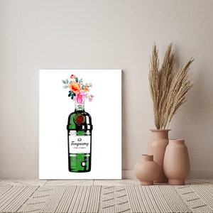 May include: A watercolour painting of a green bottle of Tanqueray gin with a bouquet of pink and orange flowers in the top of the bottle.