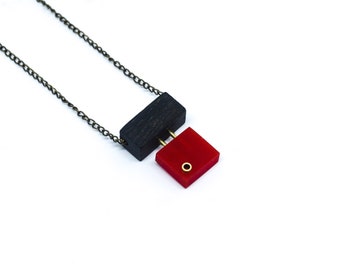 Wooden necklace with red acrylic and brass details