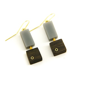 Wooden dangle & drop earrings with grey acrylic and brass details.
