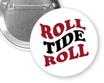 May include: A white button with a red and black design that says "Roll Tide Roll".