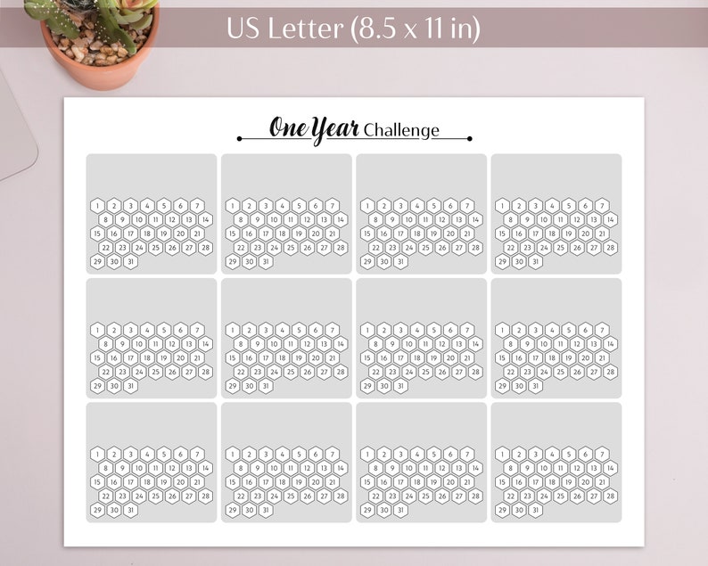 May include: A printable one-year challenge calendar with 12 monthly grids, each with 31 hexagonal cells numbered 1 to 31. The calendar is designed for a US Letter size paper (8.5 x 11 inches).