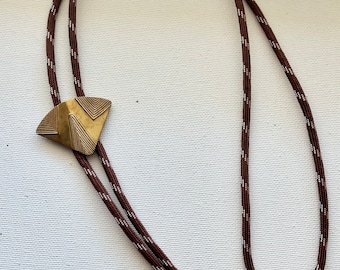 Vintage brass textured triangle bolo