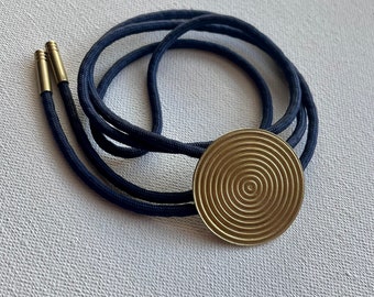 Golden brass Inner Circles bolo tie necklace