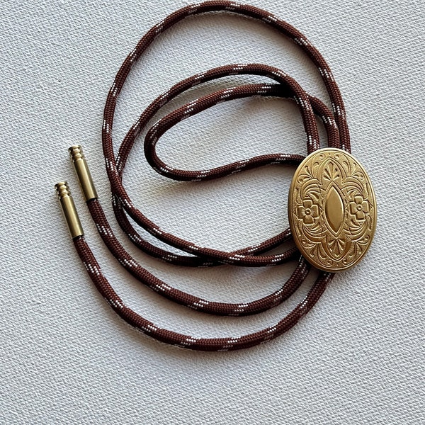 Brass oval floral medallion bolo tie necklace