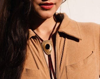 Vintage hammered brass and black onyx stone bolo tie necklace