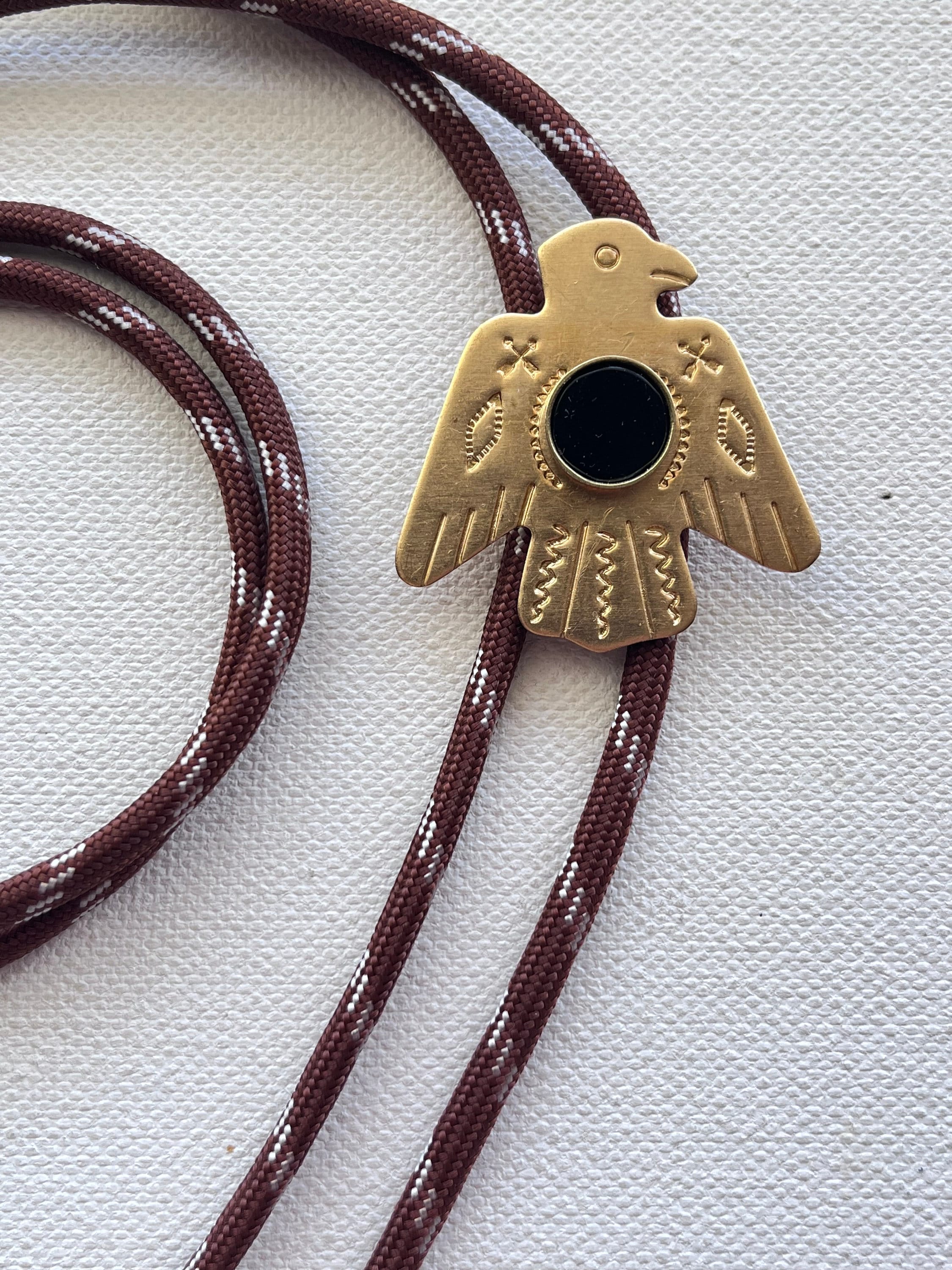 Brass Thunderbird Bolo with onyx stone