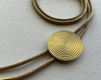 Golden brass Inner Circles bolo tie necklace