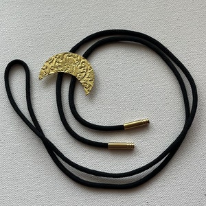 Brass floral crescent moon bolo tie necklace