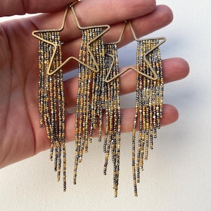 Gold and gunmetal shooting star beaded earrings