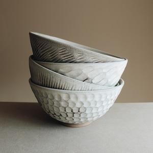 Matte white hand carved stoneware ceramic bowl