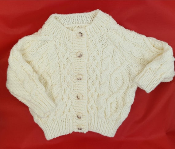 hand knitted baby aran cardigans