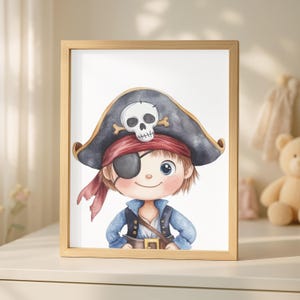 May include: A framed watercolor print of a cartoon pirate. The pirate wears a black hat with a skull and crossbones, a red bandana, and an eye patch. He is dressed in a blue jacket and vest. The frame is made of light-colored wood.