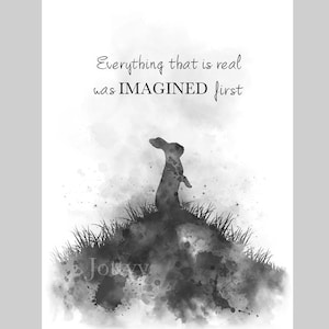 May include: Black and white watercolour print of a rabbit silhouette standing on a hill with the quote "Everything that is real was IMAGINED first".