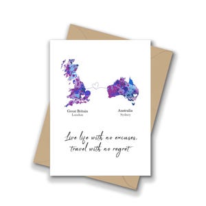 May include: A white card featuring watercolour maps of Great Britain and Australia, linked by a heart. The card includes the text "Live life with no excuses, travel with no regret." The card is set against a brown envelope.