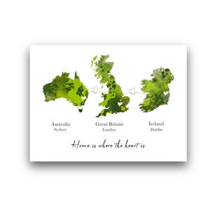 May include: A white print featuring green watercolor maps of Australia, Great Britain, and Ireland, connected by hearts. Text includes "Australia Sydney", "Great Britain London", "Ireland Dublin", and "Home is where the heart is".