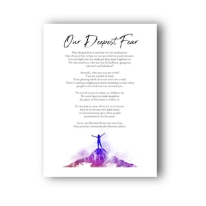 May include: A white print featuring the text "Our Deepest Fear" in elegant script. The print includes a poem with a watercolor illustration of a person standing on a mountain. The artwork is framed and ready to display.