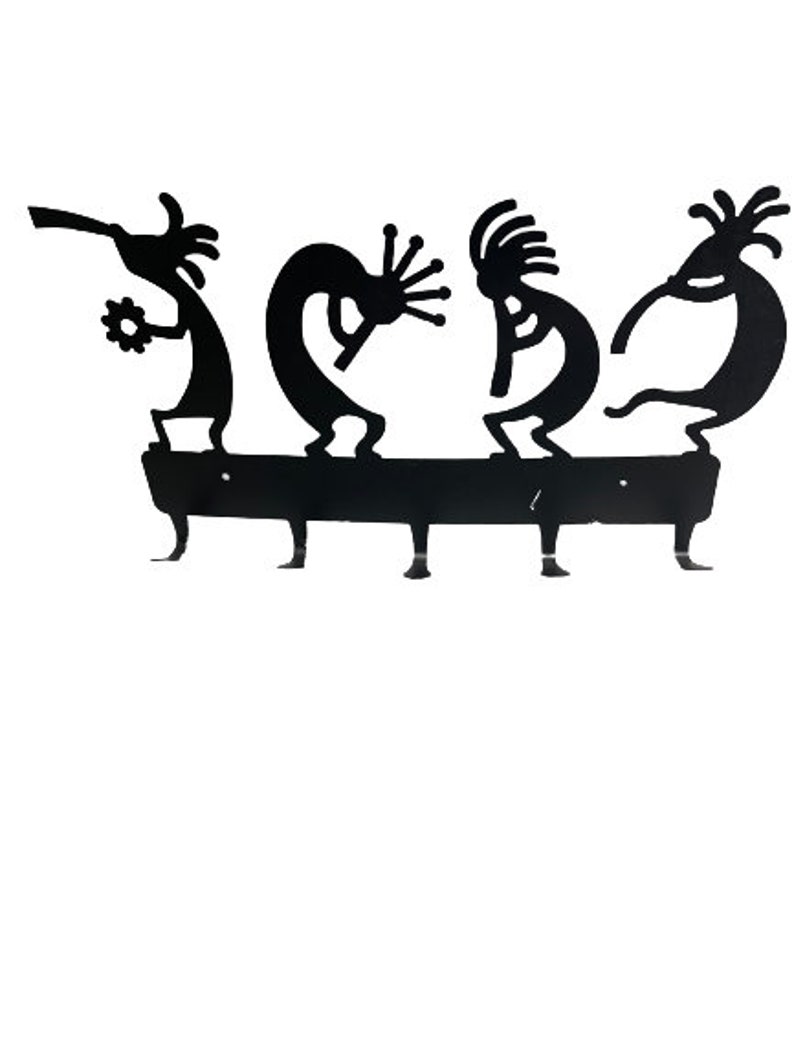 May include: Black metal key holder with four hooks shaped like Kokopelli figures playing musical instruments.