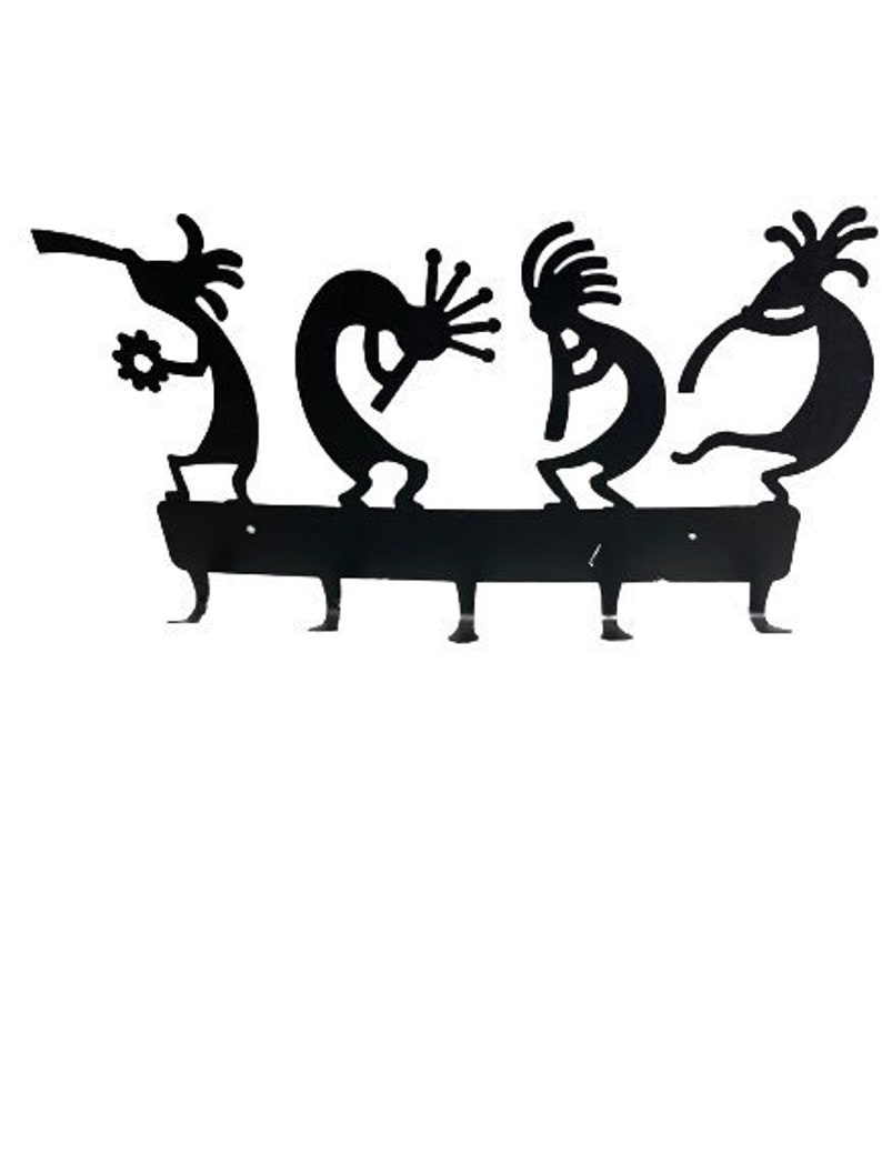 May include: Black metal key holder with four hooks shaped like stylized figures of Native American dancers.