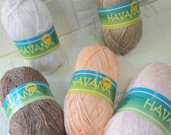 May include: Five balls of yarn in different colors, including white, beige, peach, pink, and brown. Each ball has a yellow label with the word "HAVANA" printed on it.