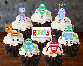May include: A collection of chocolate cupcakes topped with white frosting and colorful robot decorations. A sign that says "ROBOTS" is in the center. The robots are various colors, including orange, green, purple, and red.