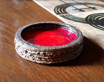 Chamotte and red glaze dish possibly by Amphora of Belgium