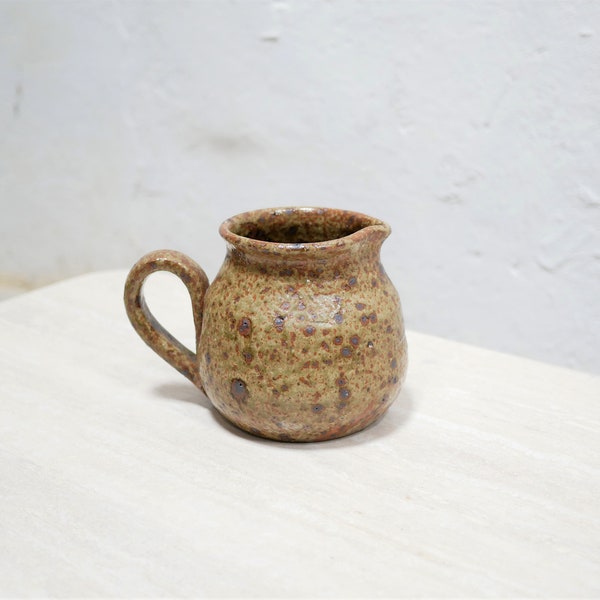 Vintage pitcher in pyrite sandstone