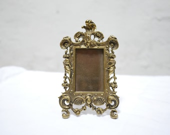 Old photo frame of Louis XV napoleon III period in gilded bronze