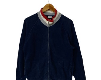 Suéter vintage liso azul marinho com zíper frontal e design elegante.