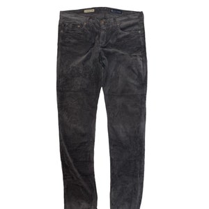 May include: Gray corduroy pants with a slim fit.
