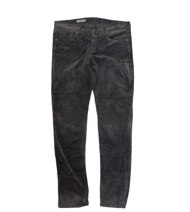 May include: Gray corduroy pants with a slim fit.
