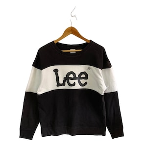 May include: Black and white striped long-sleeve sweatshirt with a white Lee logo on the front.