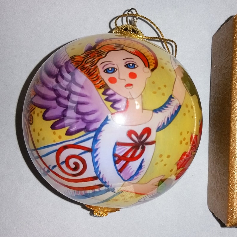 Christmas Angel flying on a gilded four inch ball 2006 Li Bien hand painted glass collectible ornament Keepsake for the future.