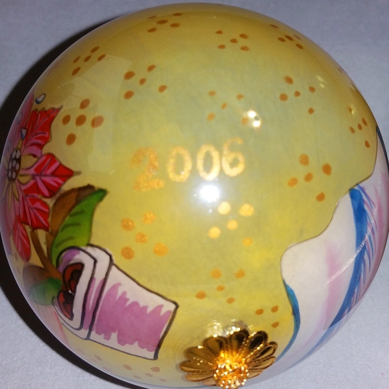 Christmas Angel flying on a gilded four inch ball 2006 Li Bien hand painted glass collectible ornament Keepsake for the future.