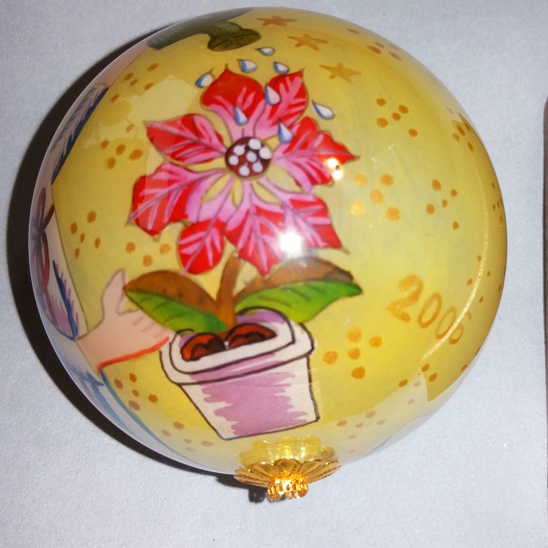 Christmas Angel flying on a gilded four inch ball 2006 Li Bien hand painted glass collectible ornament Keepsake for the future.