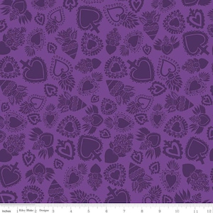 May include: Purple fabric with a repeating pattern of stylized hearts, spade shapes, and floral elements. The design features various heart shapes with decorative details, crosses, and wings. The fabric has a solid purple background.