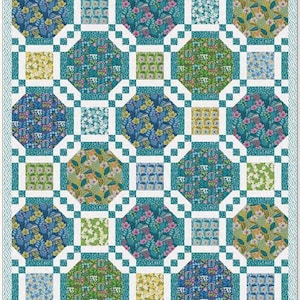 May include: A patterned quilt with a repeating design of floral and geometric shapes. The quilt incorporates a range of colours, including blue, green, yellow, and pink. The quilt is bordered with a teal and white pattern.