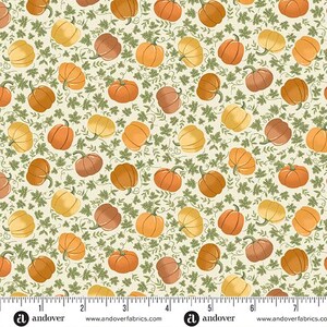 May include: A repeating pattern of pumpkins in shades of orange, yellow, and brown, interspersed with green leaves, on a cream-colored background. The pumpkins vary in size and shape, creating a fall harvest theme.
