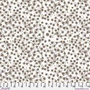 May include: Off-white fabric with a repeating pattern of brown circles, dots, and connecting lines. The design has a hand-drawn, sketched appearance. The fabric is marked with inch measurements along the bottom edge.