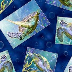 May include: A blue fabric with a repeating pattern of sea turtles swimming in the ocean. The turtles are green and brown with light blue and white accents. The background is a dark blue with light blue and white bubbles.