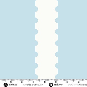 May include: A light blue fabric with a white stripe down the center. The stripe has a scalloped edge with rounded circles.