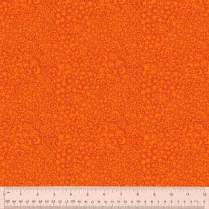 Pode incluir: Tecido laranja com um padrão repetitivo de pequenas estrelas e redemoinhos.